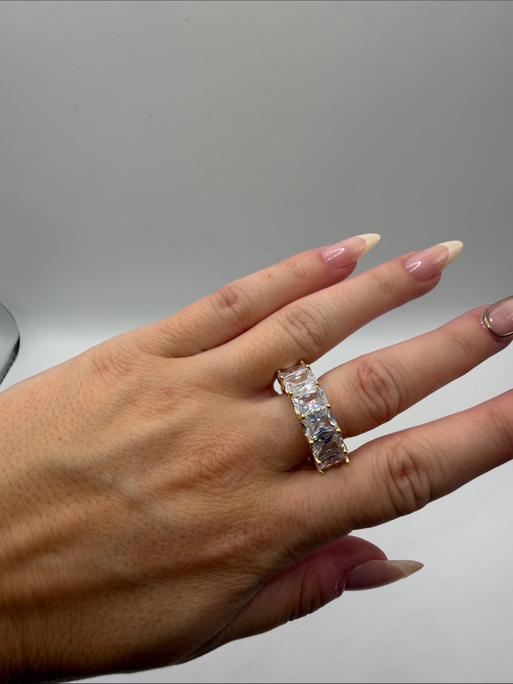 126. 18K Gold Plated Ring with Clear Emerald-Cut Stones. Size 7